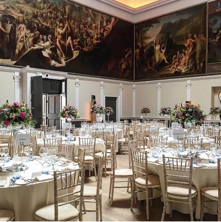Elegant event space in RSA House with fine china and floral centerpieces for formal gatherings.