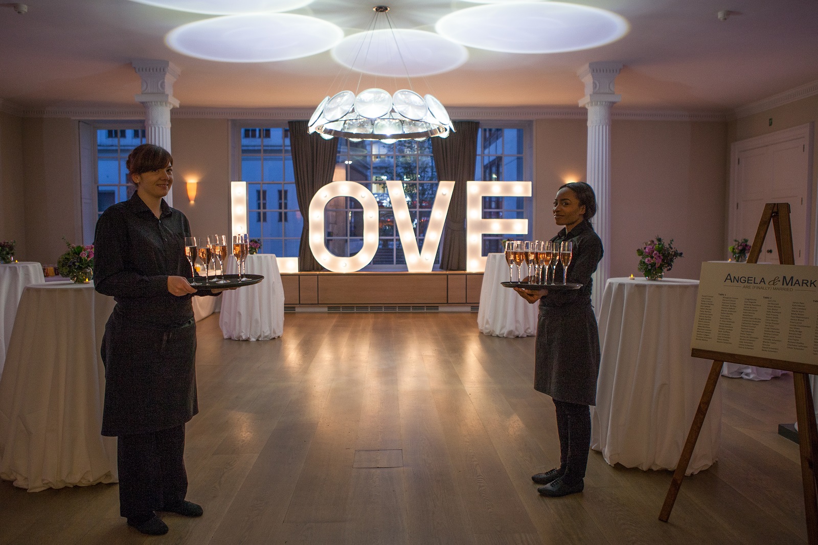 Benjamin Franklin Room with illuminated "LOVE" sign, ideal for weddings and celebrations.