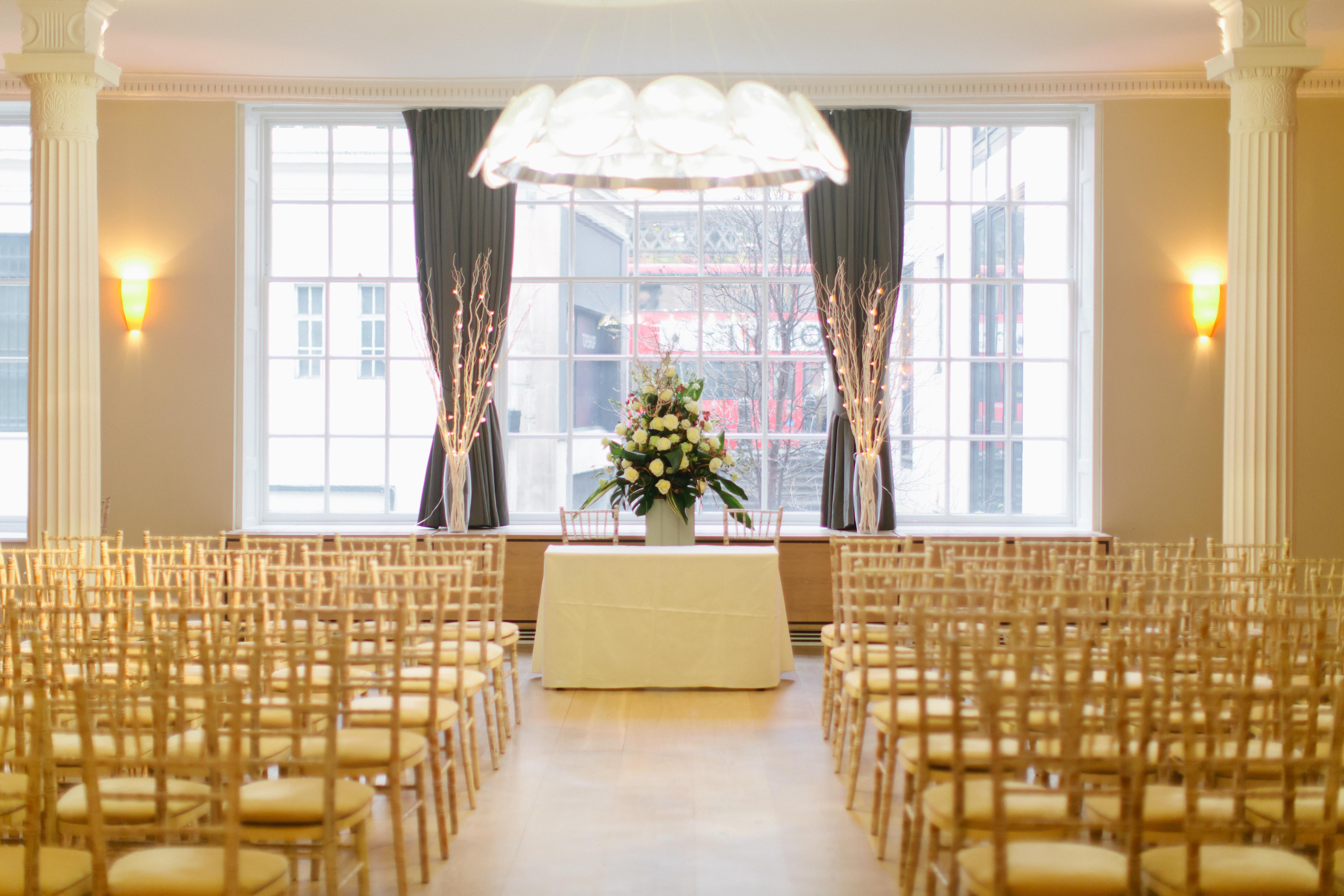 Elegant Benjamin Franklin Room with floral centerpiece, ideal for weddings and events.