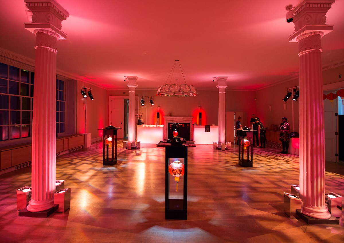 Elegant Benjamin Franklin Room with red lighting, perfect for gala events and networking.