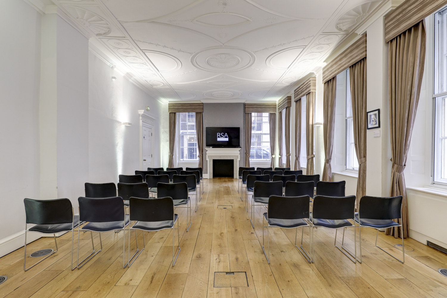 Tavern Room at RSA House: elegant meeting space with black chairs for corporate seminars.