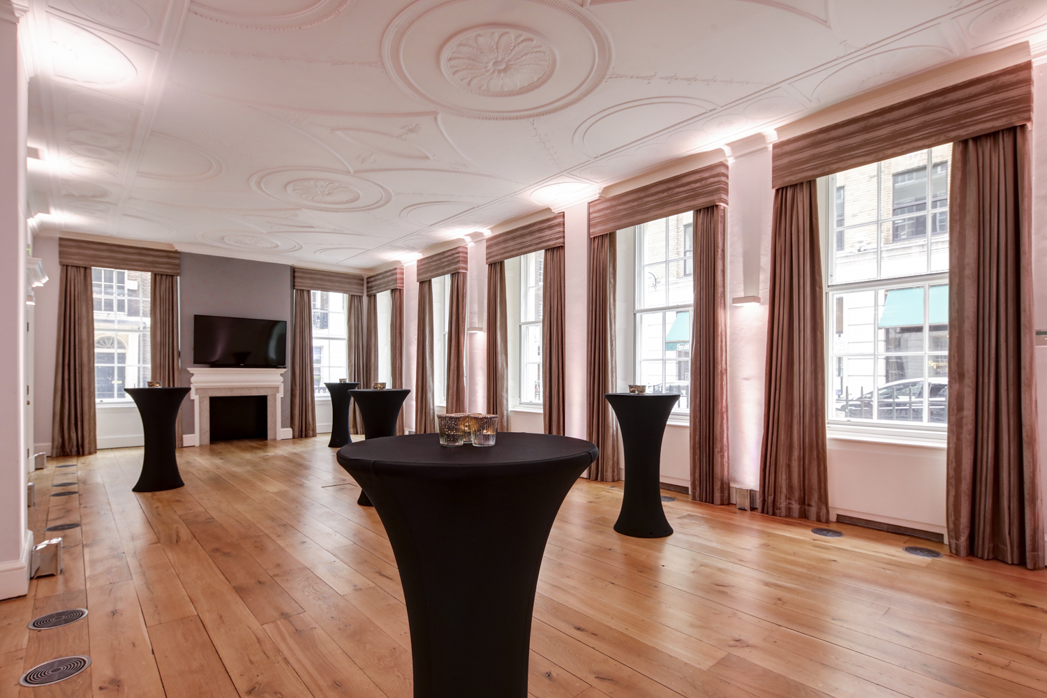 Elegant Tavern Room at RSA House with high-top tables for networking events.