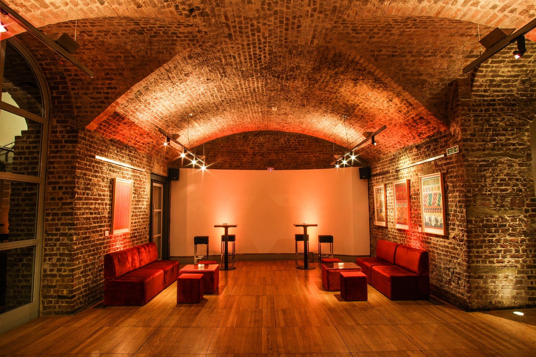 Stylish event space in RSA House with exposed brick walls, perfect for gatherings.