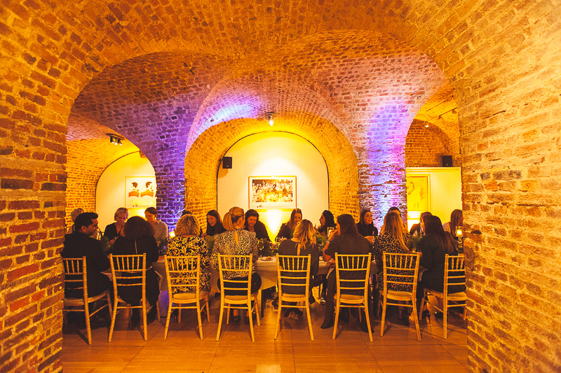 Intimate dining setup in brick archway at RSA House for private events and corporate dinners.