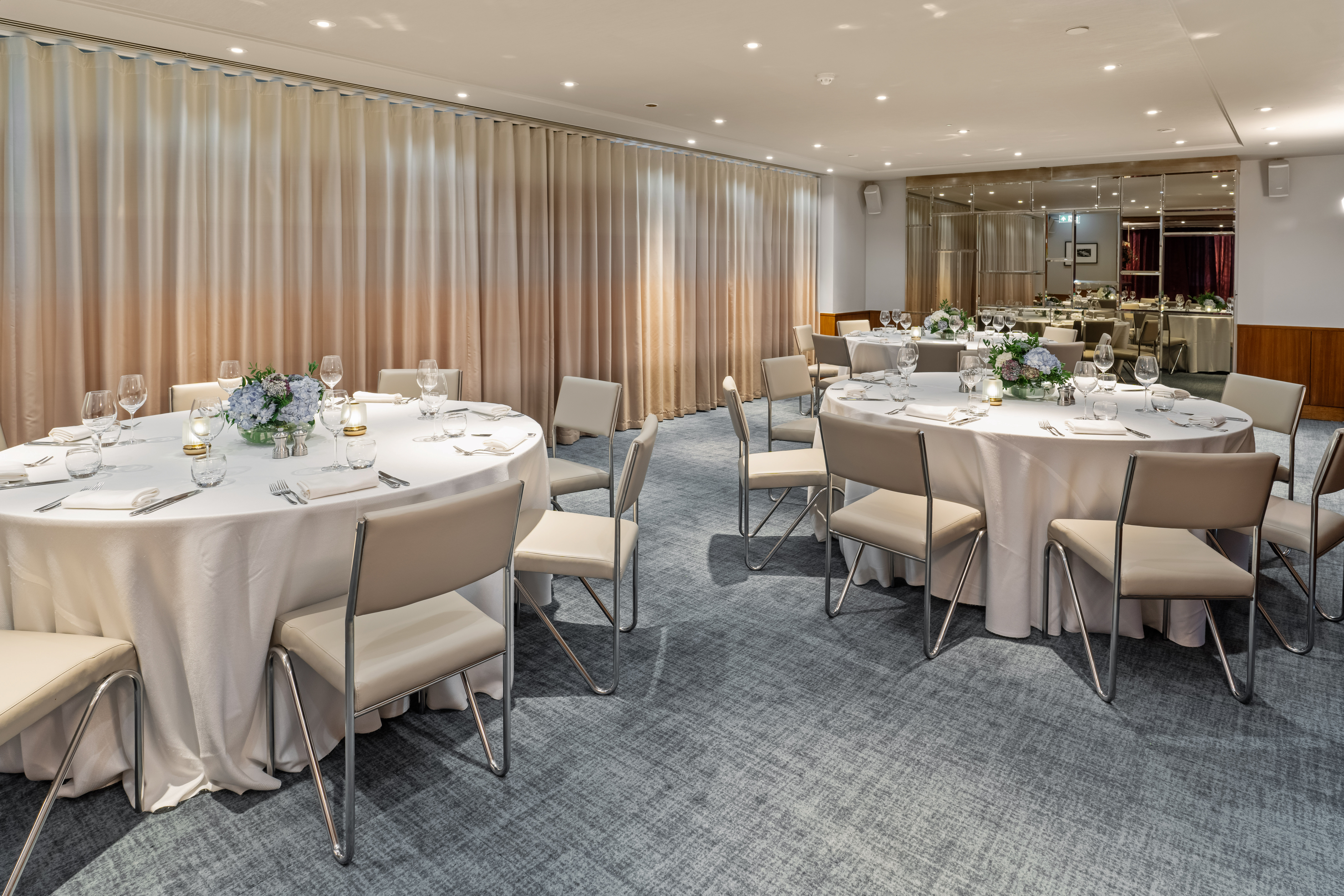Beaufort Room at Bluebird Chelsea: elegant event space with floral centerpieces for meetings.