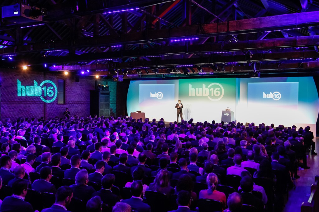 Dynamic conference at The Porter Tun, featuring modern visuals and engaged audience.