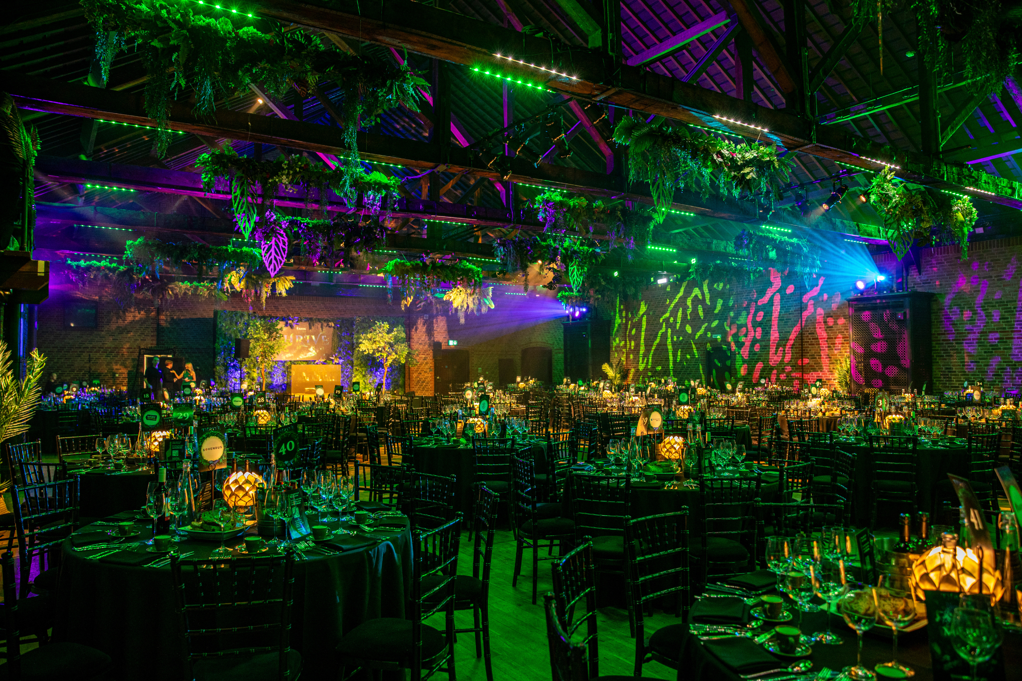 Vibrant event space at The Porter Tun with lush greenery for themed gatherings.
