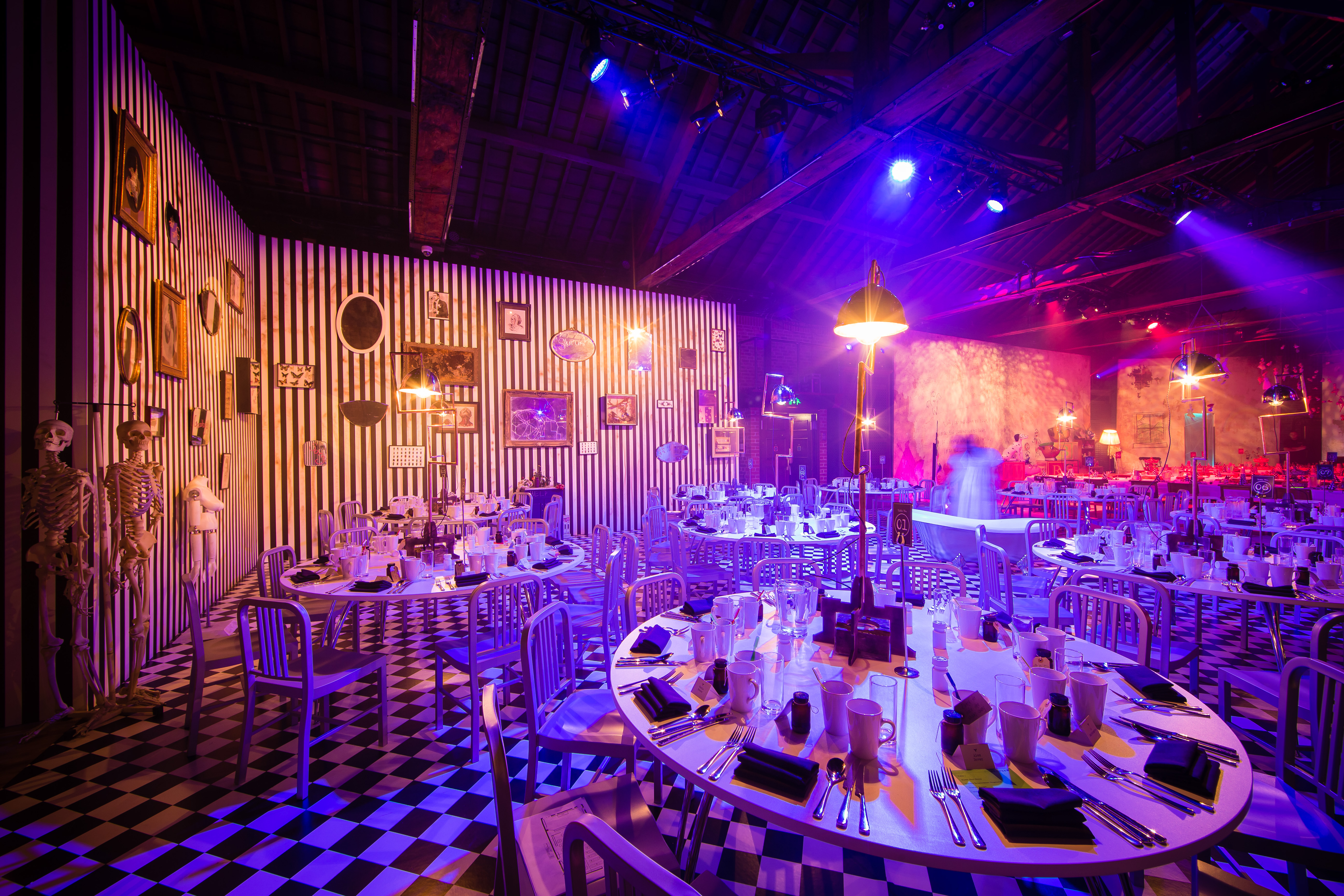 Porter Tun event space with round tables and vibrant lighting for gatherings and corporate events.