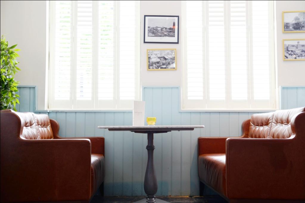 Cozy leather sofa meeting space in The Chapel Bar for casual gatherings and brainstorming.
