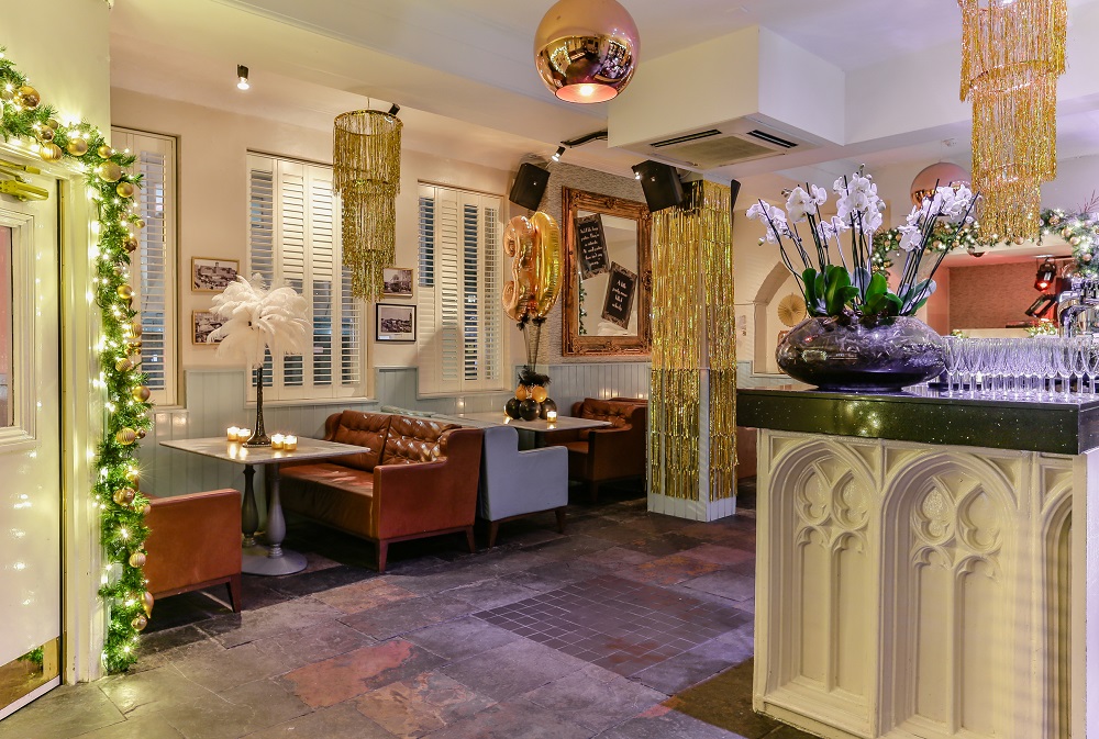 Stylish event space in The Chapel Bar with cozy seating for gatherings and meetings.