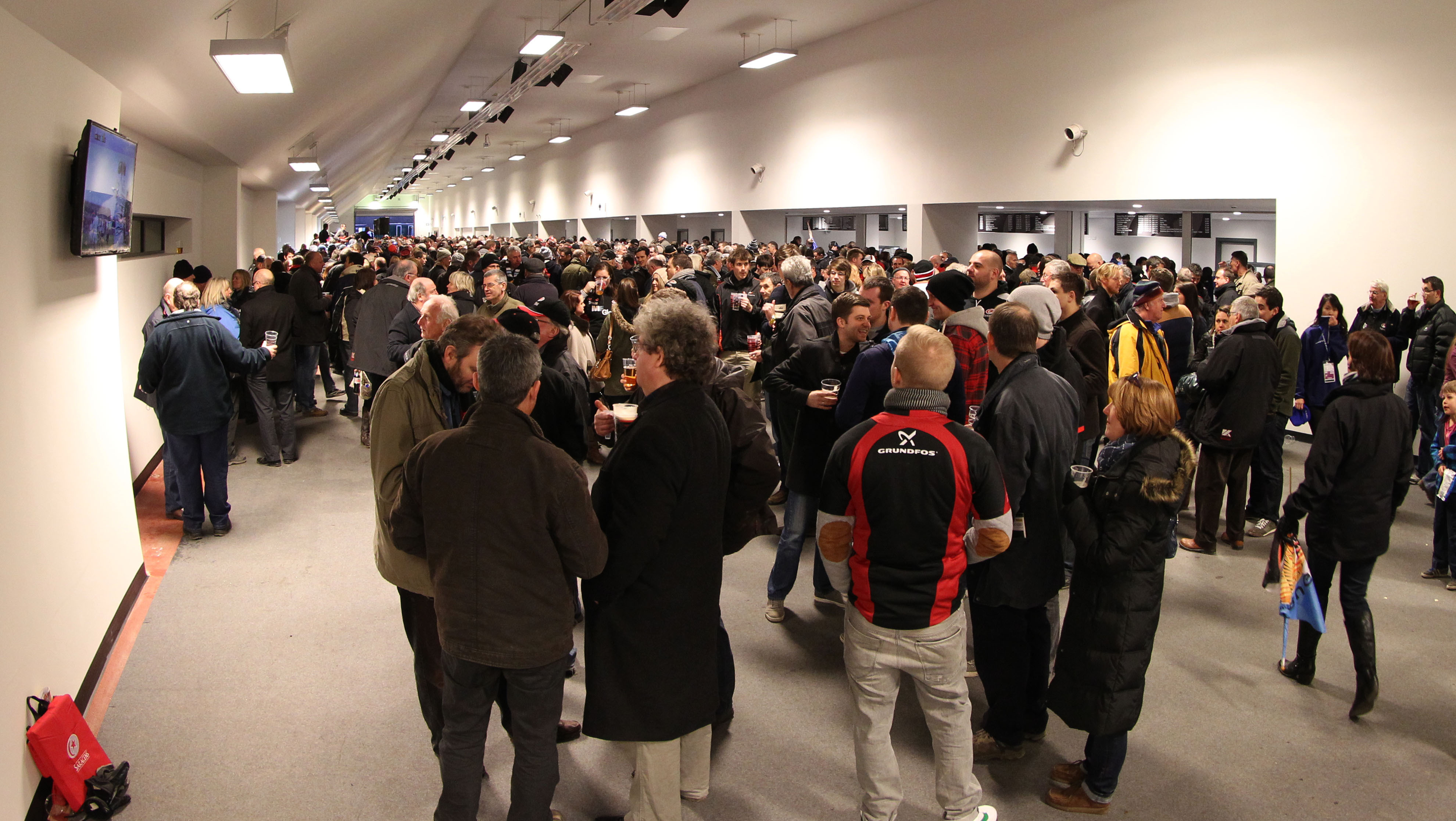 "Busy Olympic Bar at StoneX Stadium, ideal for networking events and gatherings."