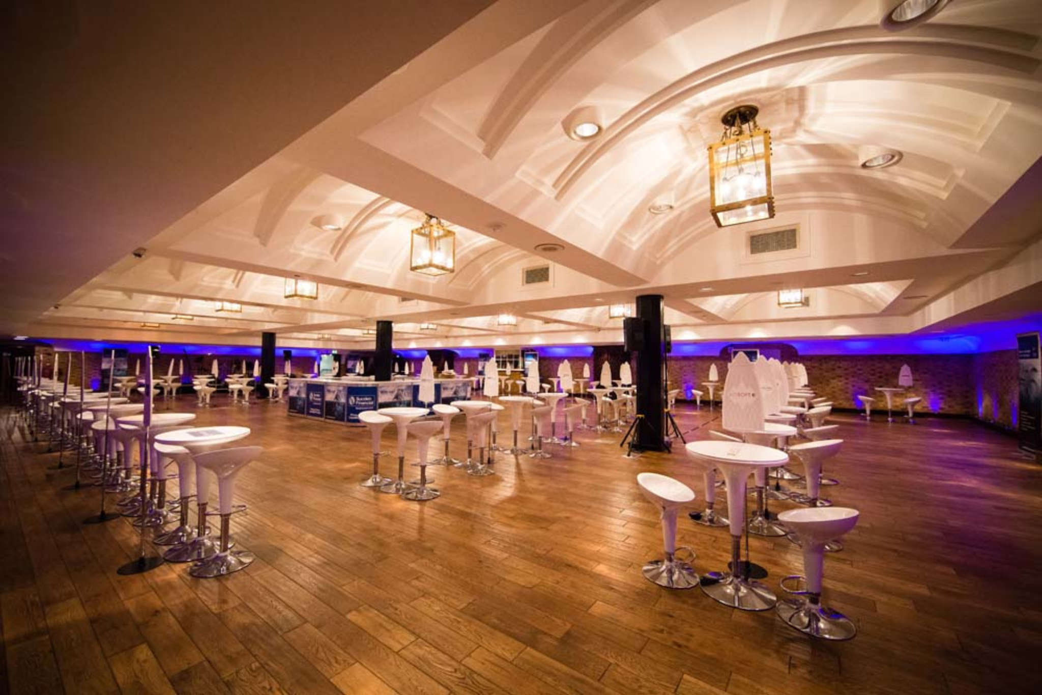 Elegant event venue with high ceilings, ideal for networking and receptions.