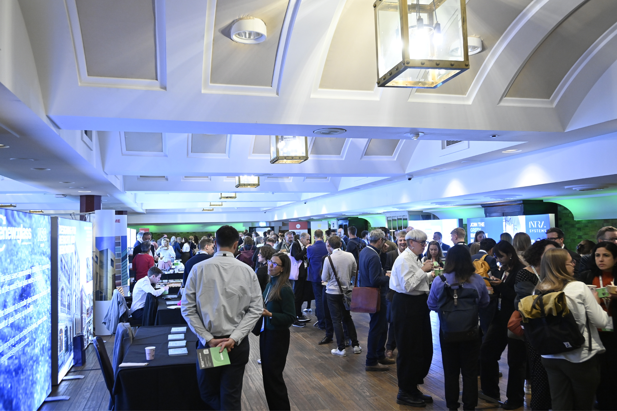 Networking event at The King George III with vibrant exhibitor booths and lively atmosphere.