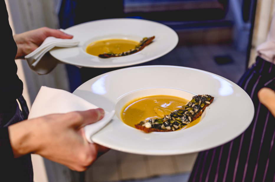 Elegant gourmet dishes at The King George III, showcasing exquisite catering presentation.