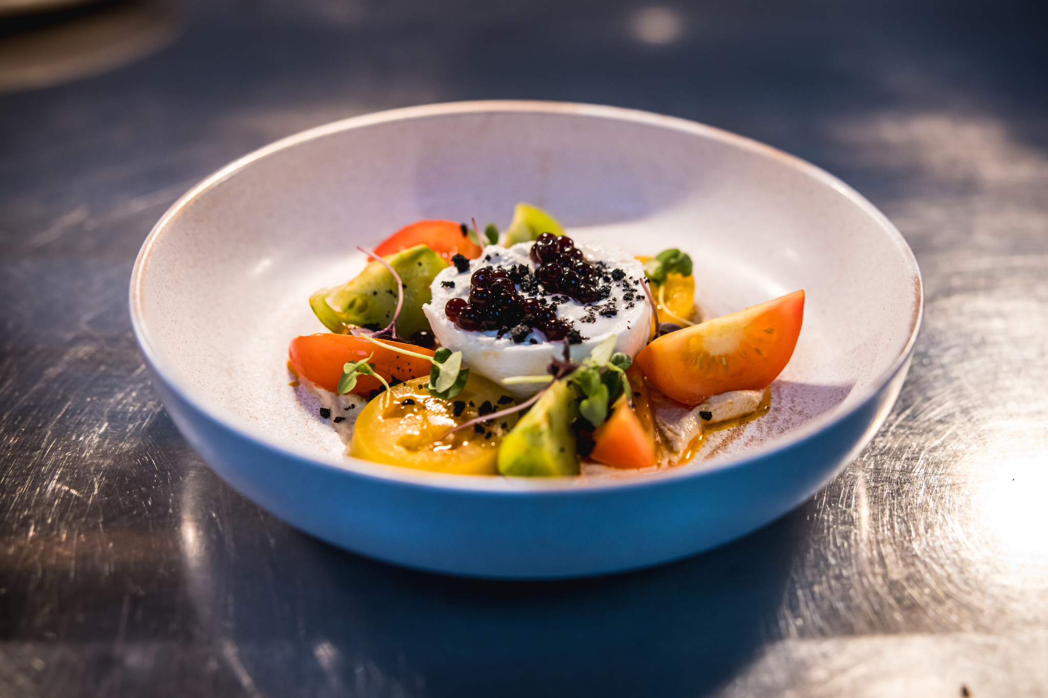 Plated dish with fresh tomatoes and cream at The King George III, ideal for upscale events.