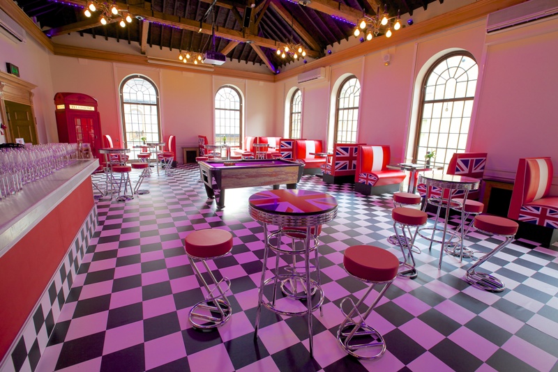 Vibrant British-themed event space with bold seating, ideal for gatherings and parties.