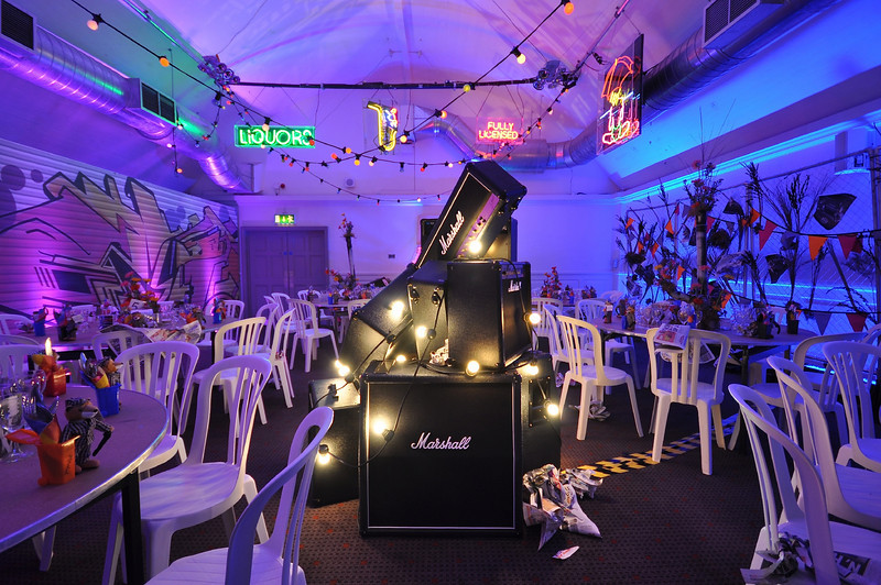 Vibrant event space at The Smeaton Vaults with neon decor for social gatherings.