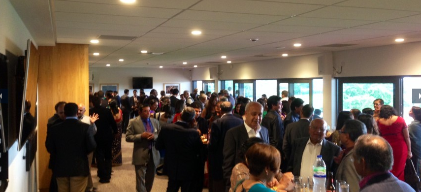 Networking event at Players Lounge, StoneX Stadium; bright atmosphere, engaging conversations.