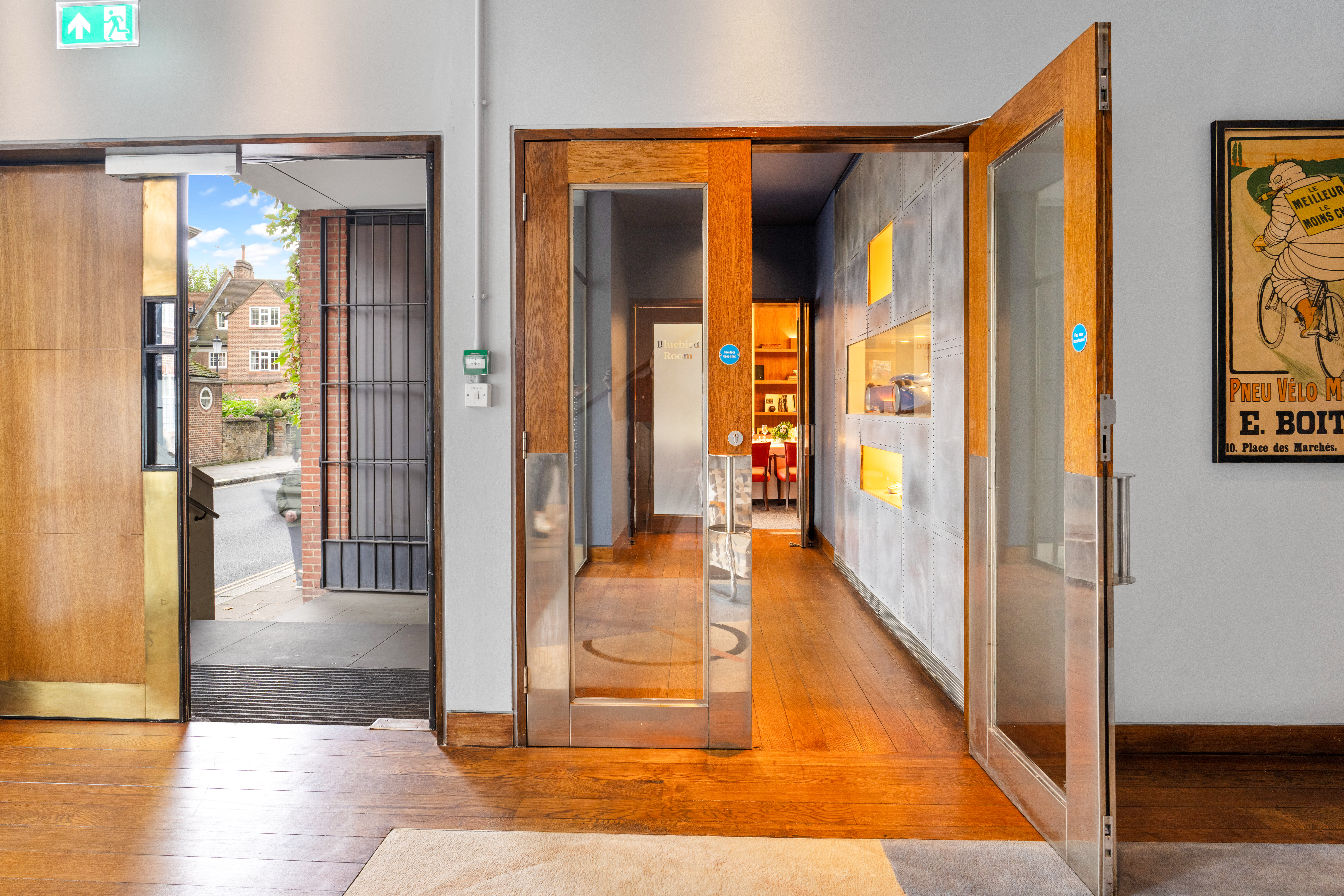 Bluebird Room entrance with glass doors, ideal for meetings and events in Chelsea.