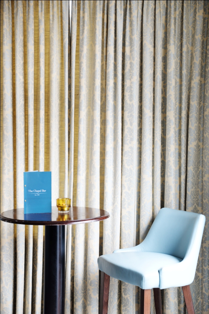 Elegant meeting space in The Chapel Bar with polished table setup for networking events.