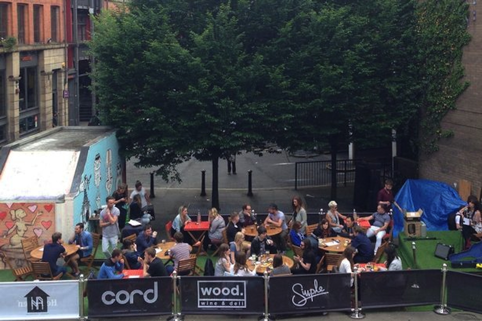 Vibrant outdoor event space in Tib Street Garden for casual gatherings and networking.