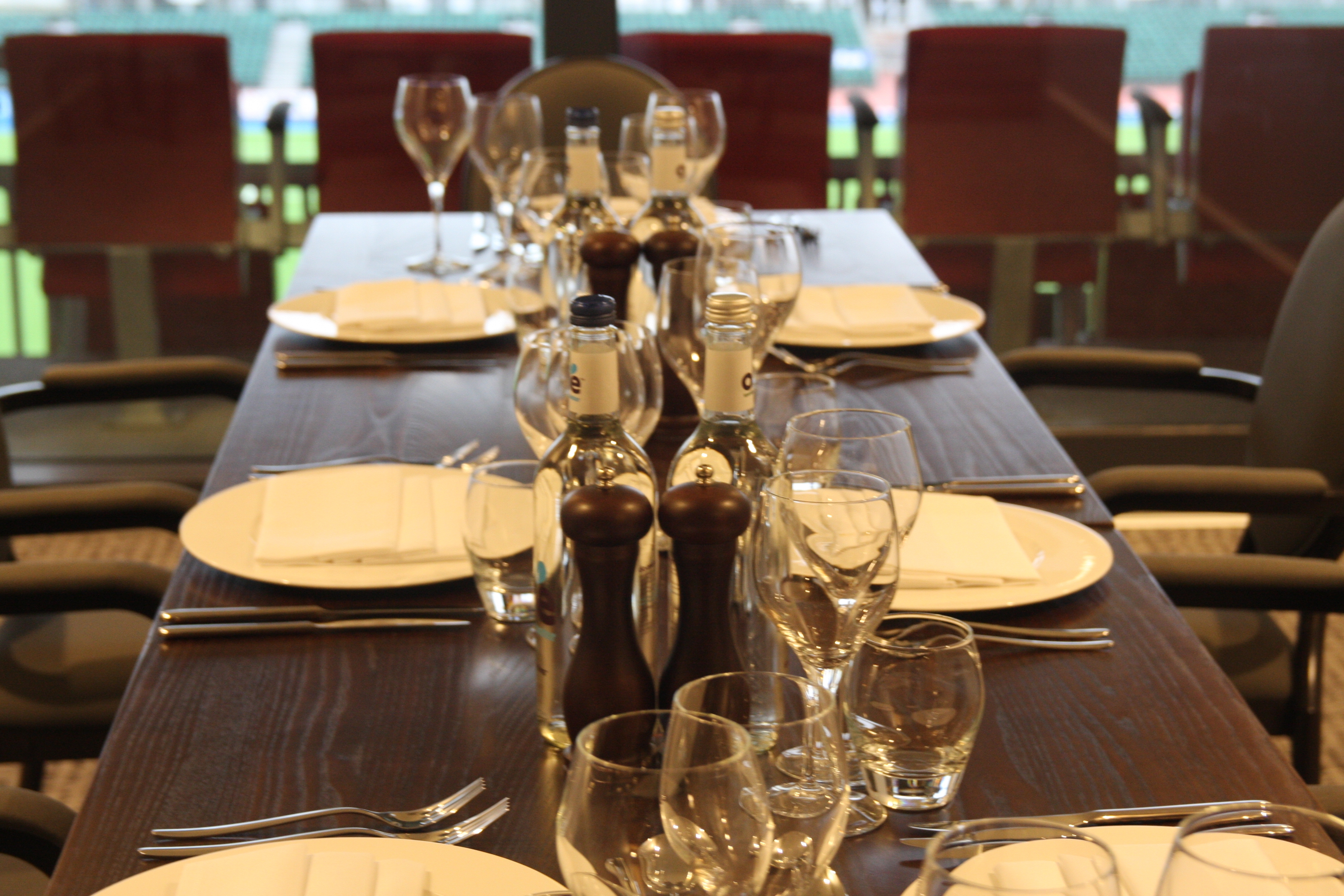 Executive Boxes at StoneX Stadium with elegant dining setup for corporate events.