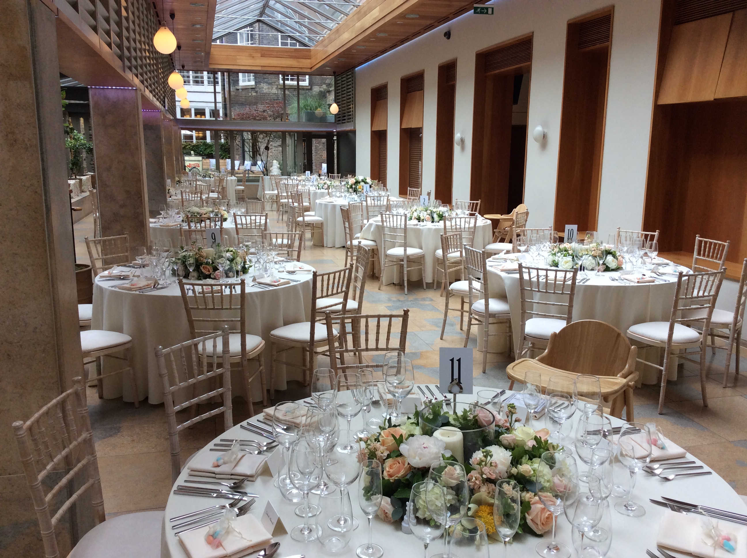 Elegant banquet space with floral centerpieces for weddings and corporate events.