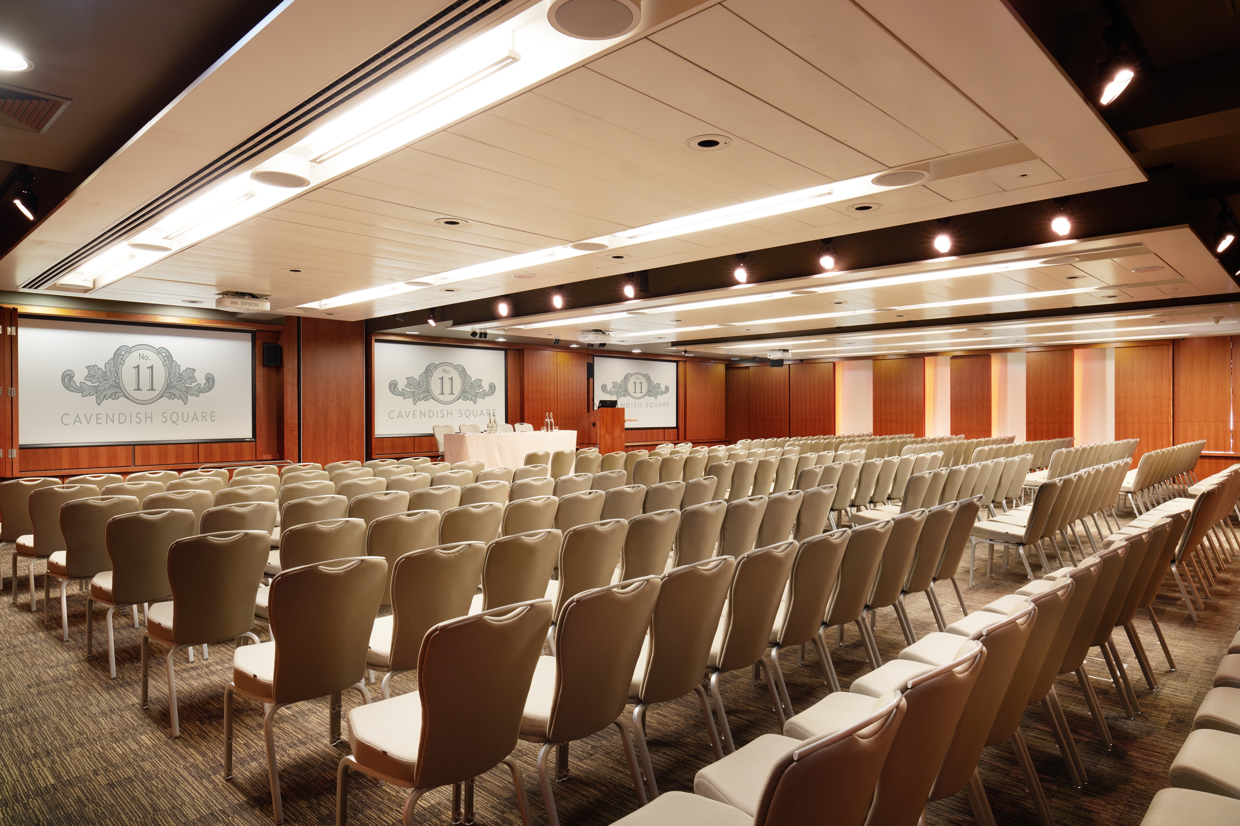 Burdett Suite conference room with rows of chairs, ideal for meetings and events.