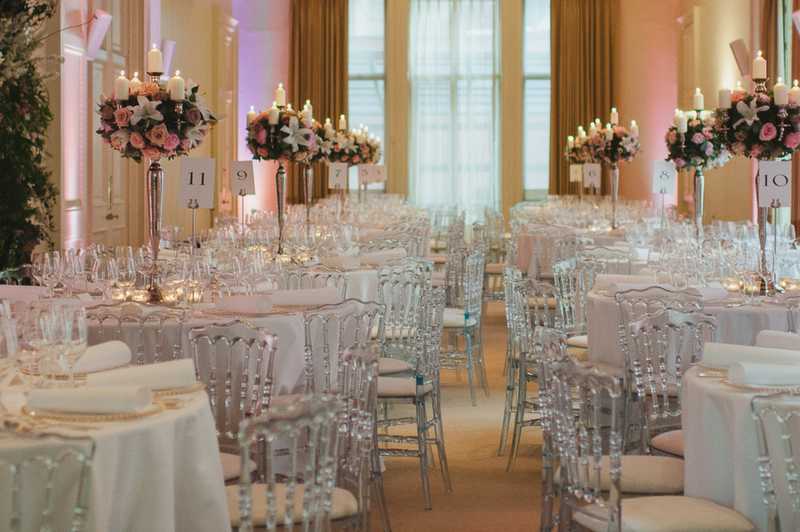 Elegant event space with floral centerpieces, ideal for weddings and corporate events.