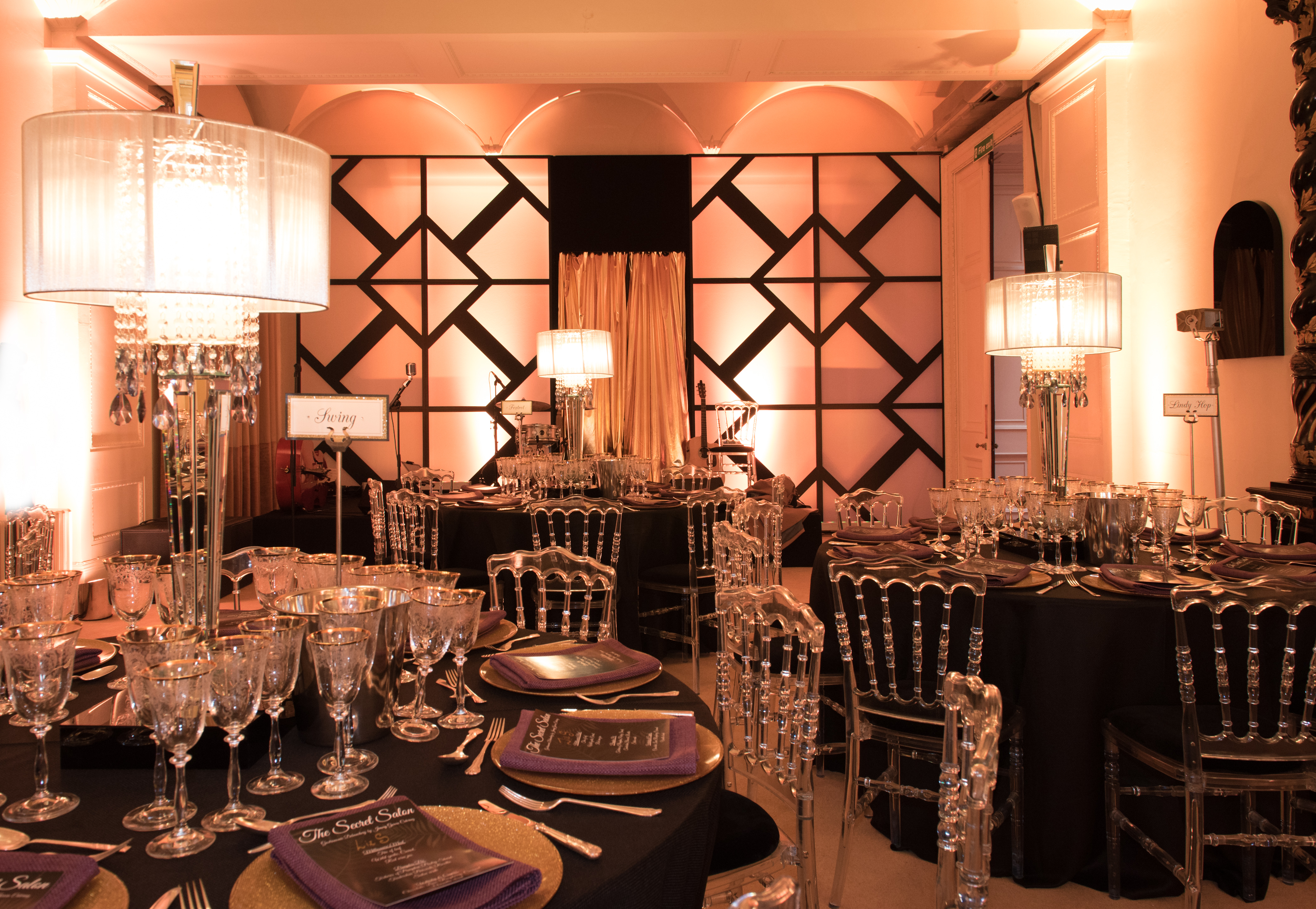 Elegant event space in Kent House with chic black and gold decor for upscale gatherings.