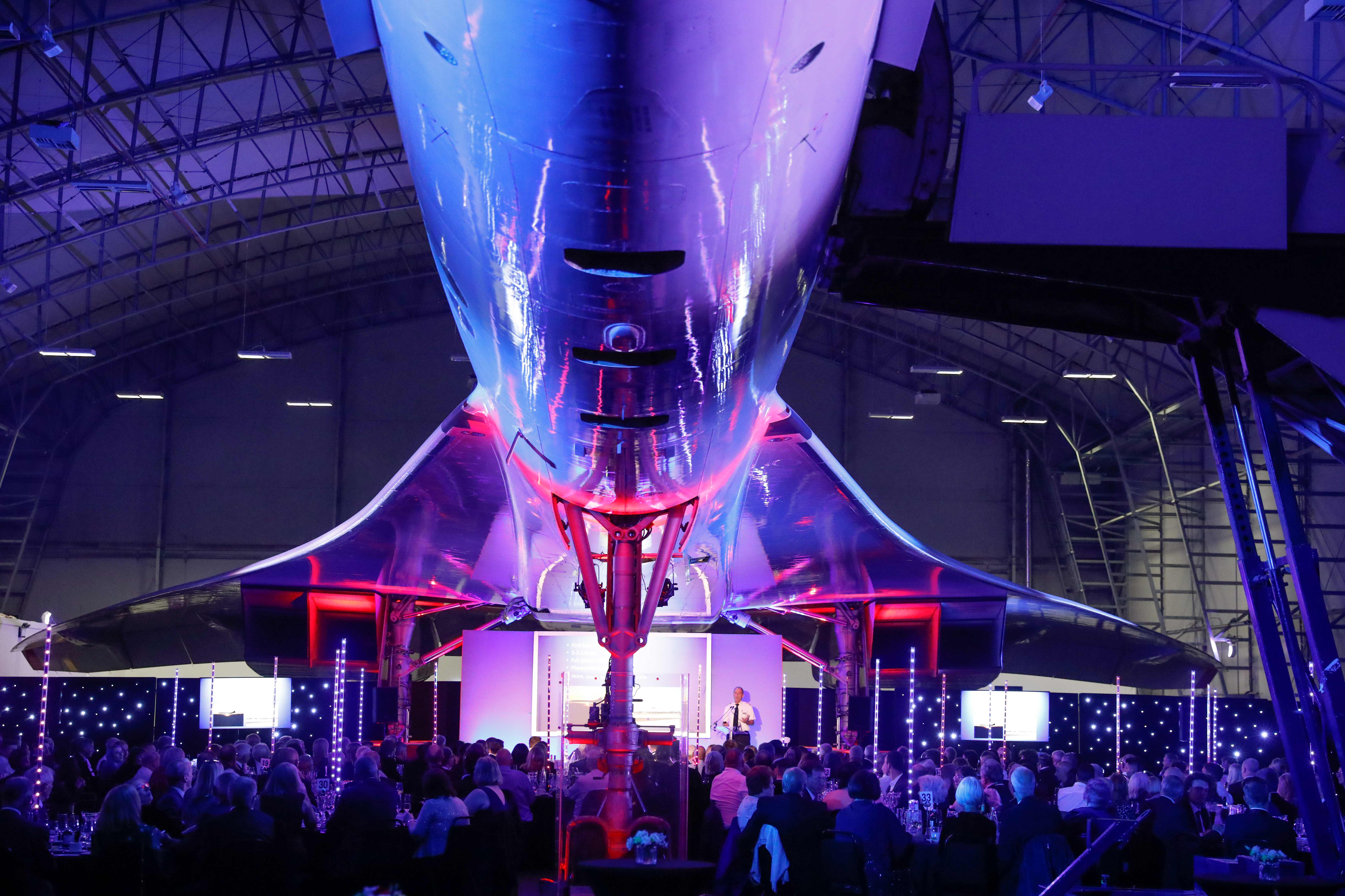 Concorde Hangar event space with aircraft centerpiece, perfect for corporate gatherings.