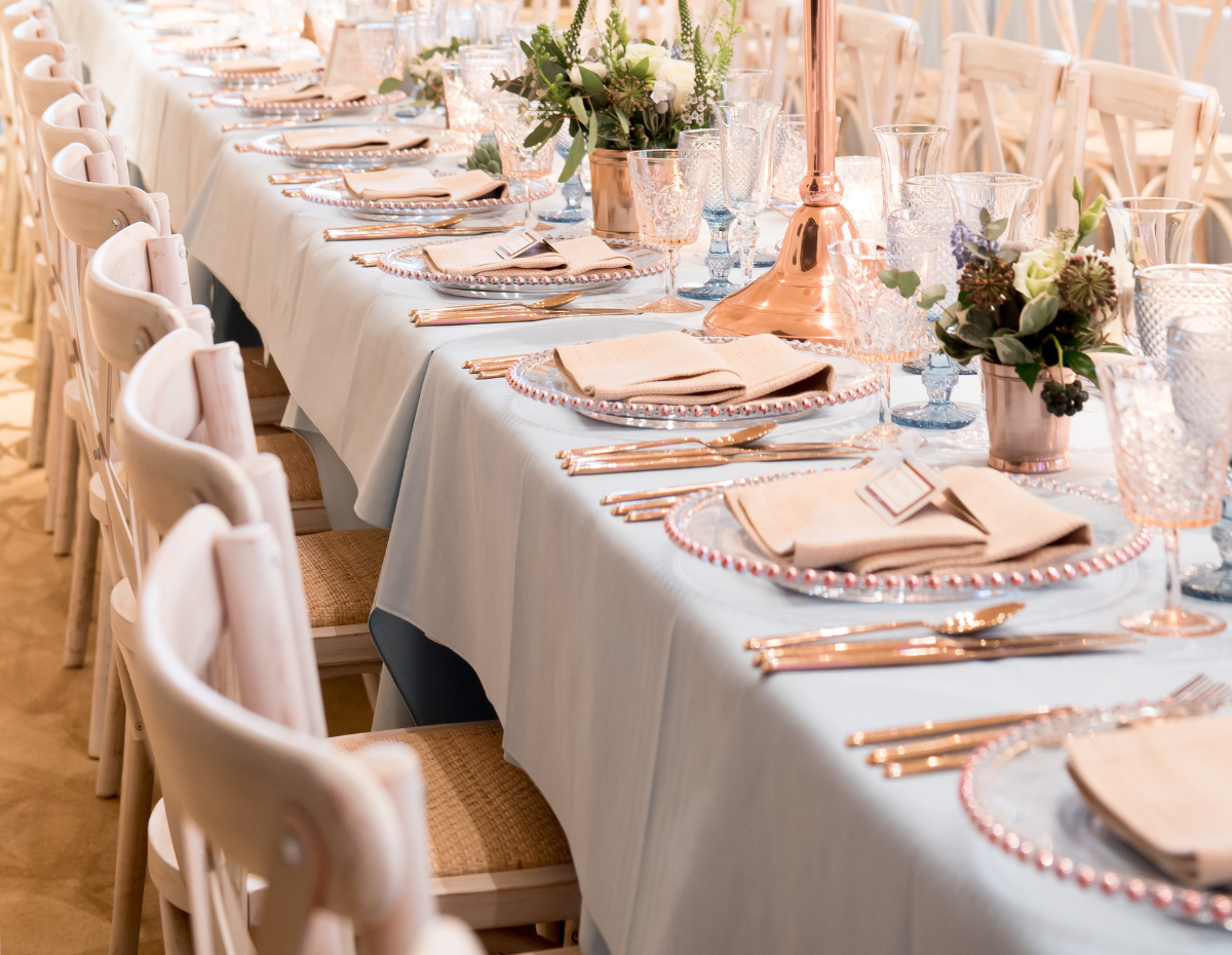 Elegant banquet table with floral centerpieces at Kent House, ideal for weddings and upscale events.