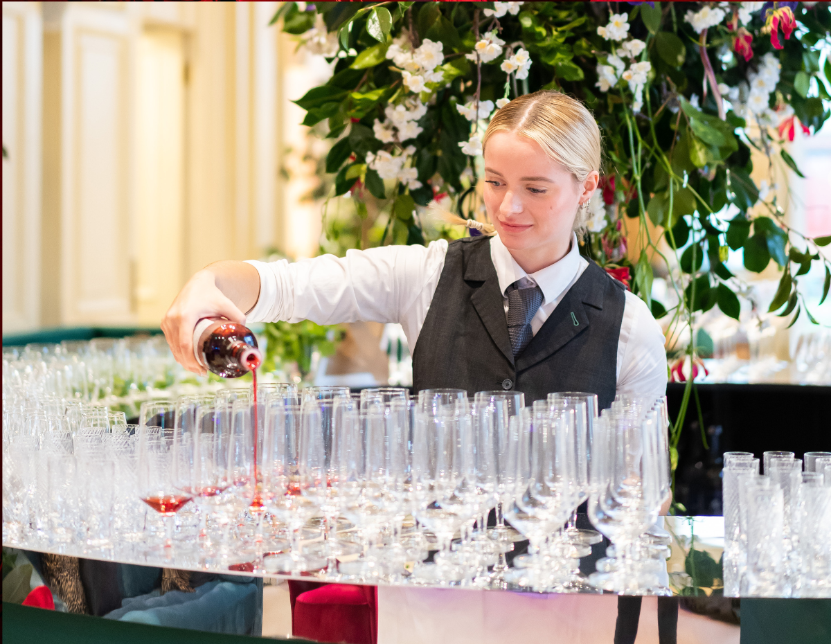 Professional bartender pouring drinks at elegant event in Kent House Knightsbridge.