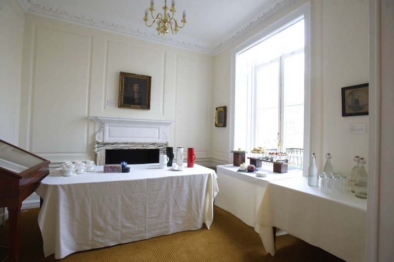 Council Room at The Royal Society, elegantly set for networking event with white linens.