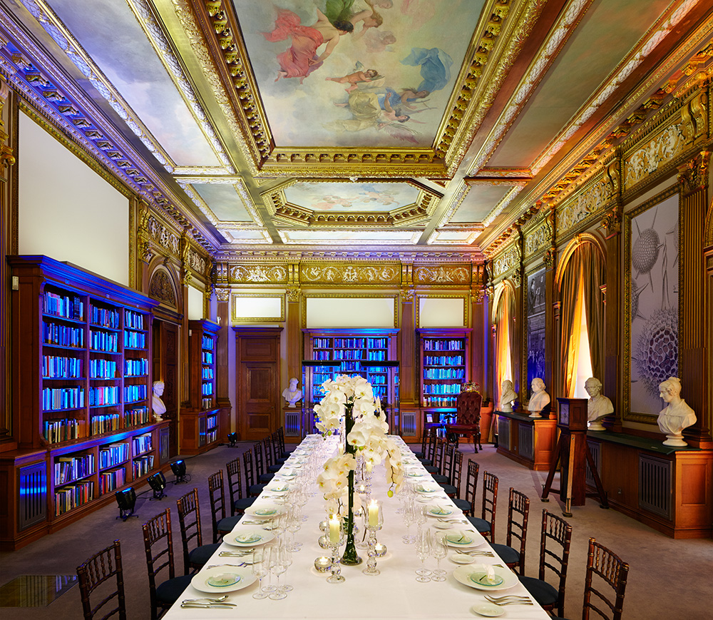 Elegant dining space with ornate ceiling for upscale events and corporate dinners.