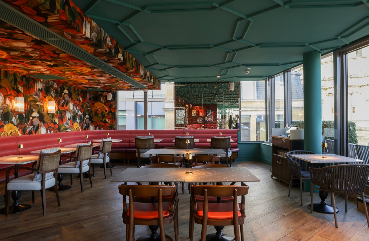 Sabine Rooftop Bar at Leonardo Royal Hotel, vibrant decor for events and gatherings.