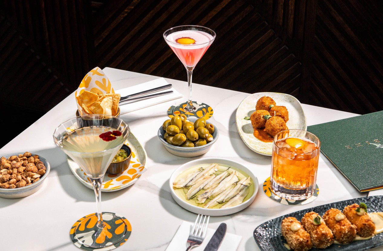 Elegant appetizers and cocktails at Sabine Rooftop Bar, perfect for networking events.