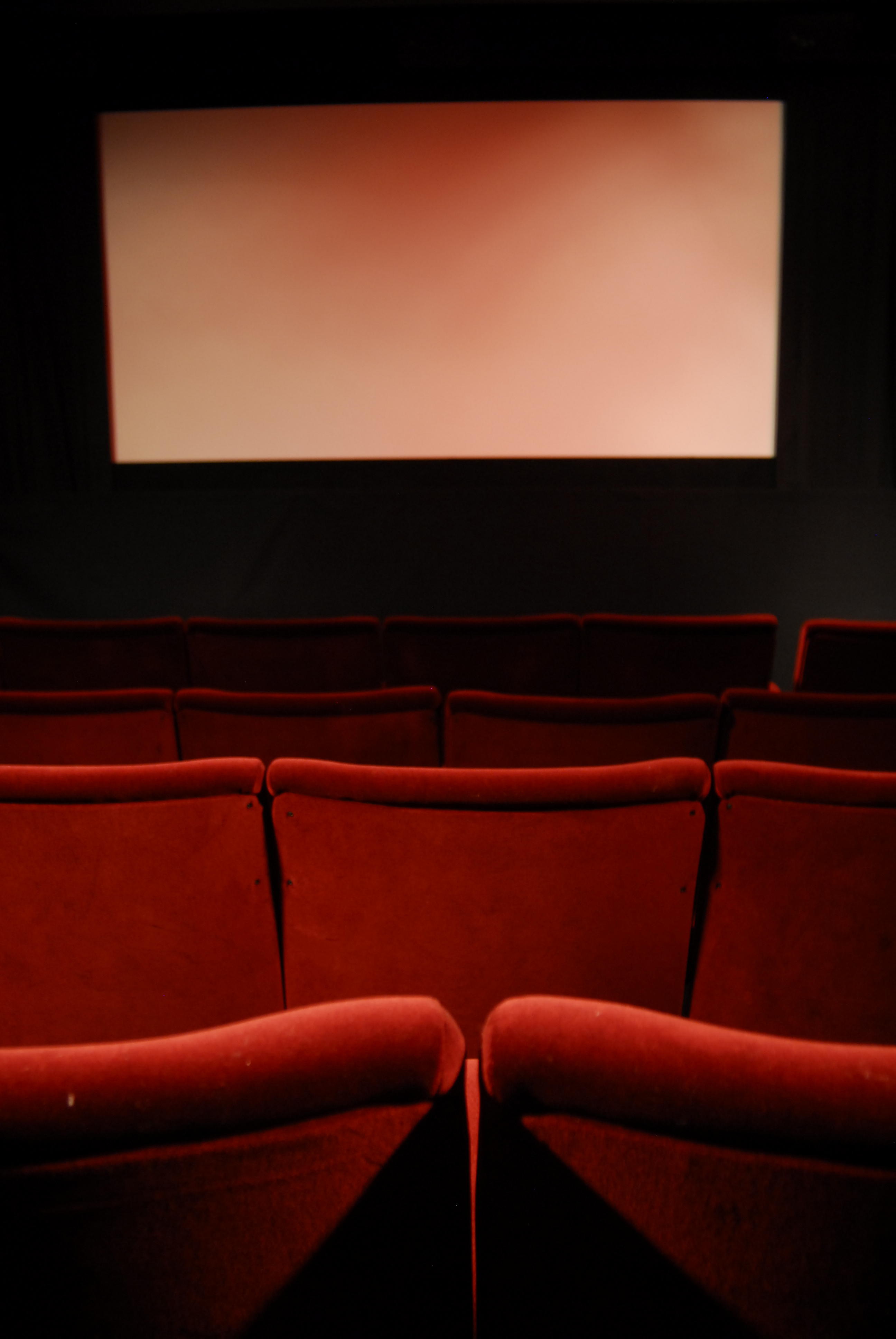 Red plush theater seats in Cinema 2 at ICA, perfect for film screenings and presentations.
