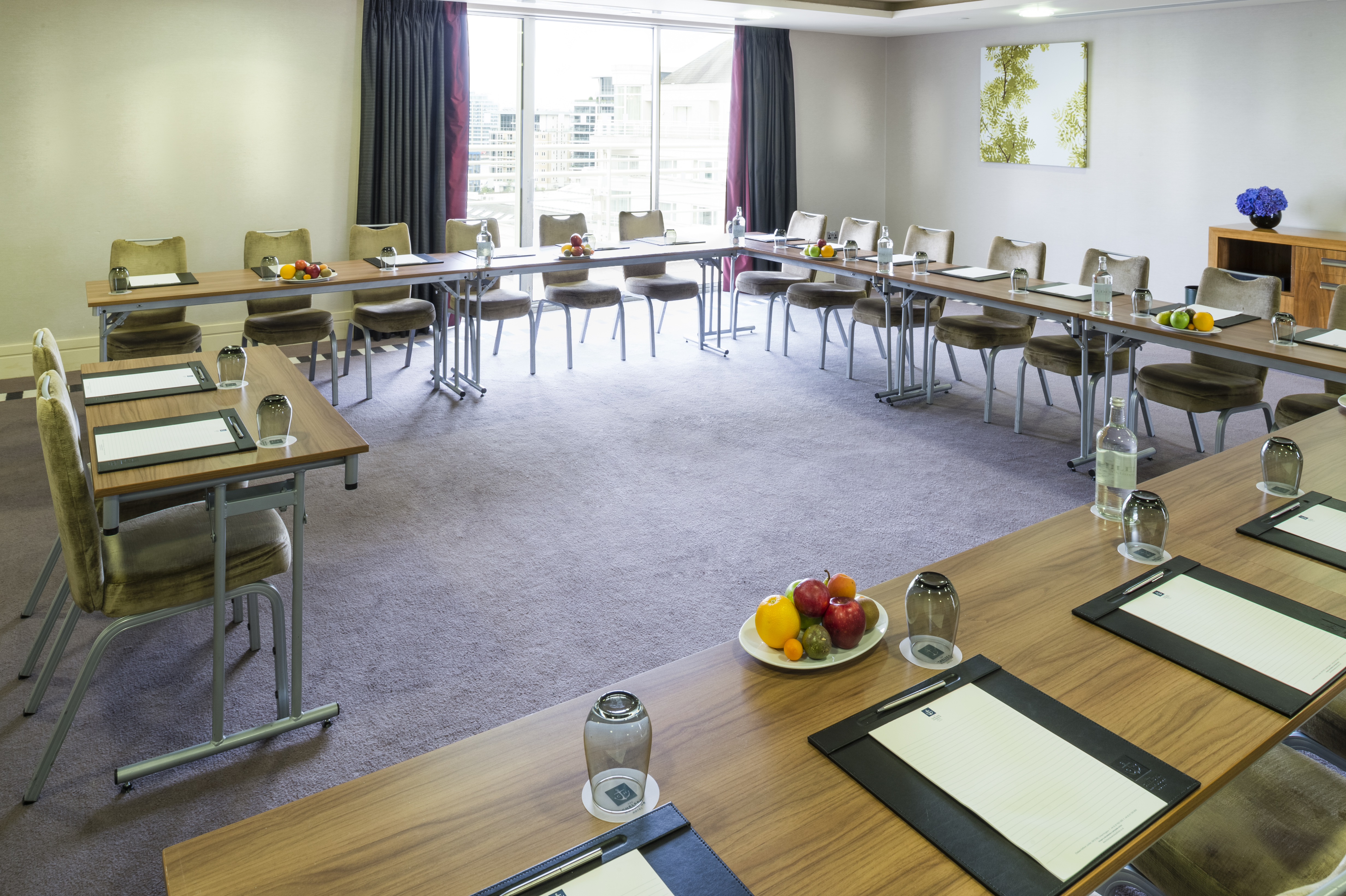 Battersea Suite meeting room with U-shaped tables, ideal for professional events.