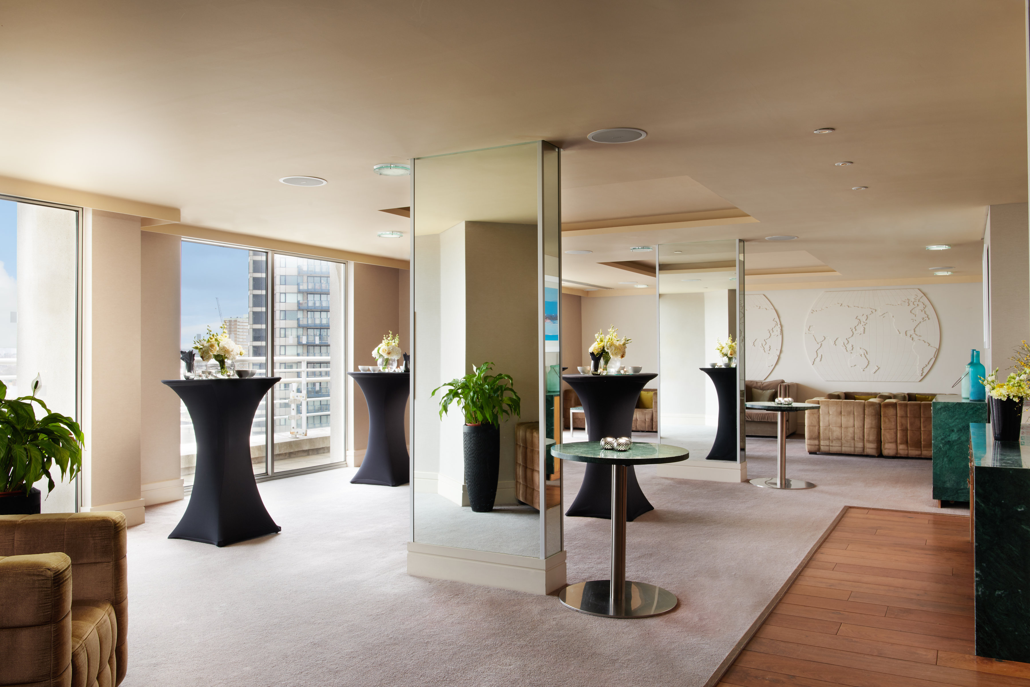 Albert Suite at Chelsea Harbour Hotel: modern event space with panoramic windows for corporate gatherings.
