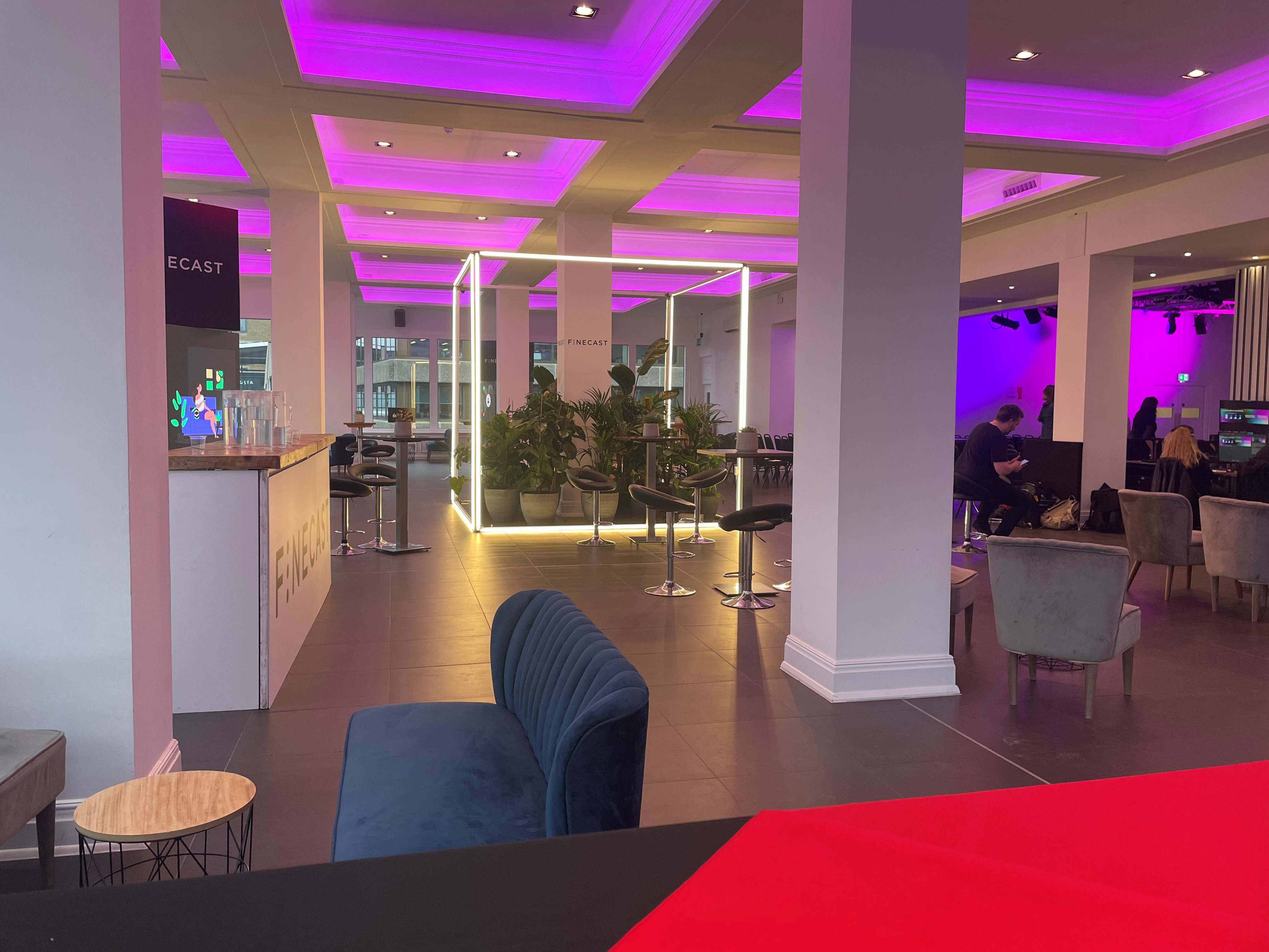 Modern Upper River Room in The Mermaid London with purple lighting for events.