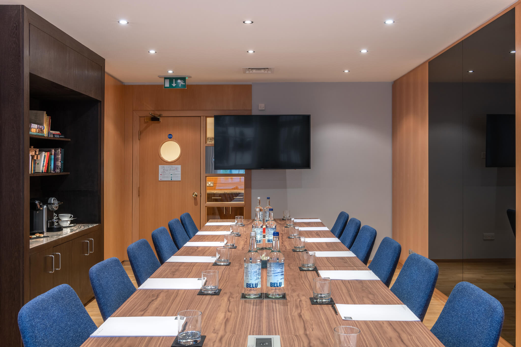Modern meeting room in K+K Hotel George, ideal for corporate events and presentations.