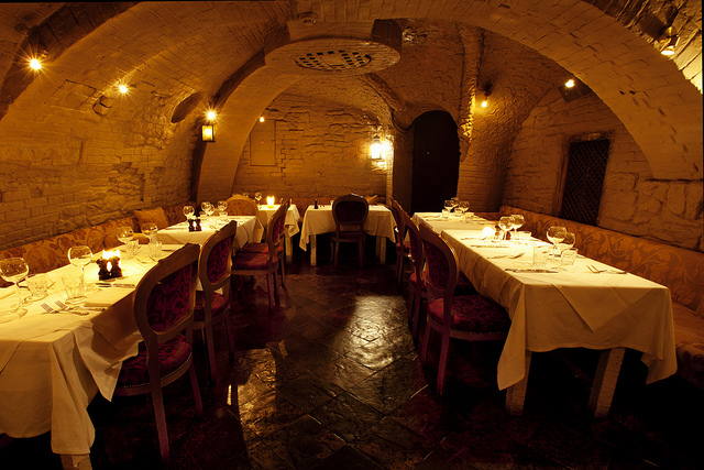 Intimate dining space with arched stone ceilings for private dinners and corporate events.