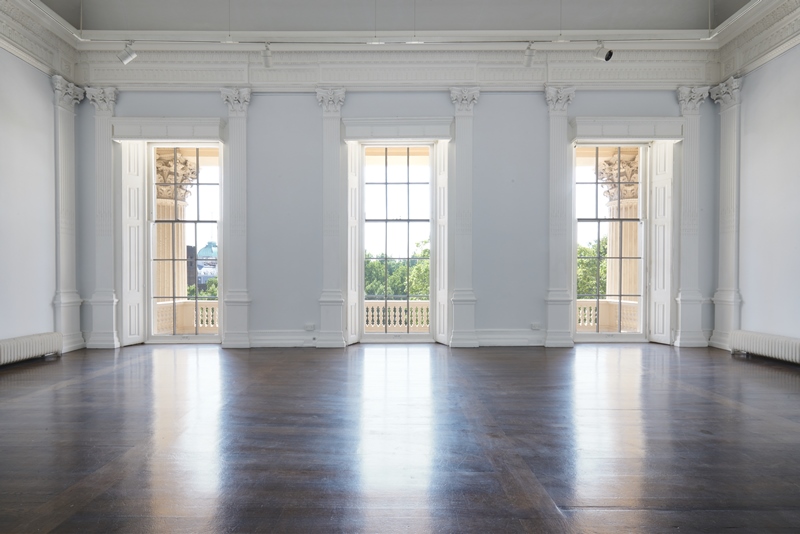 Spacious ICA event space with large windows, ideal for meetings and workshops.