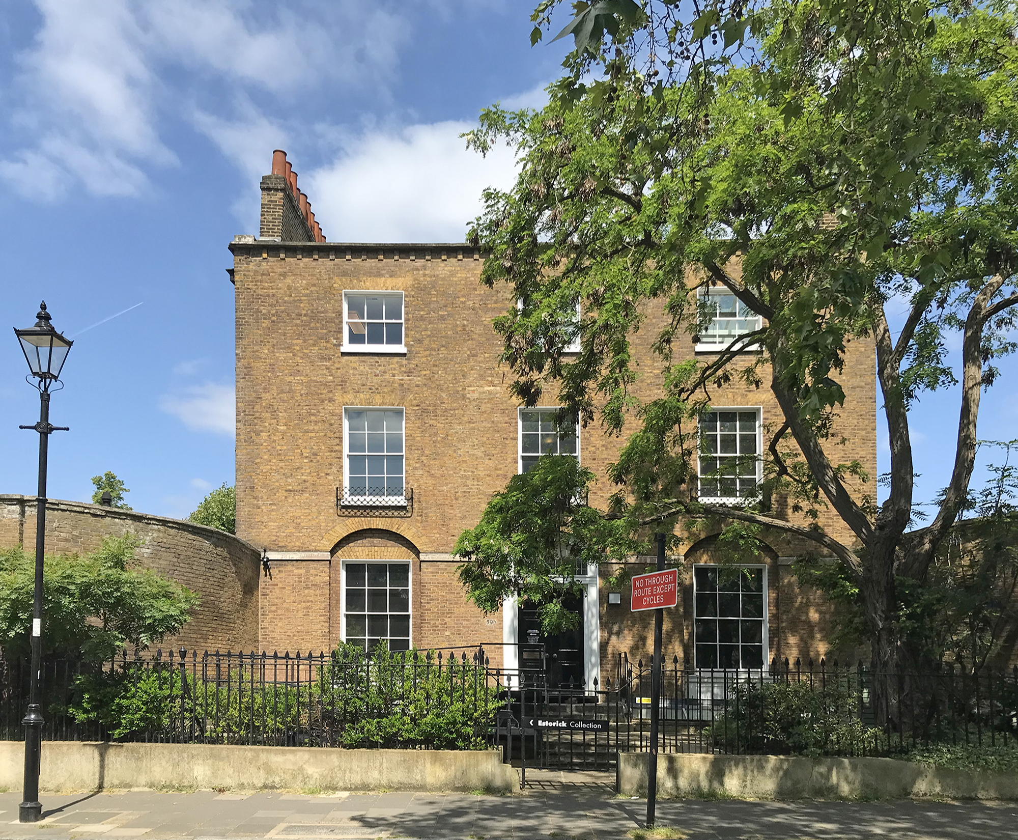 Charming brick venue with large windows for intimate meetings and creative workshops.