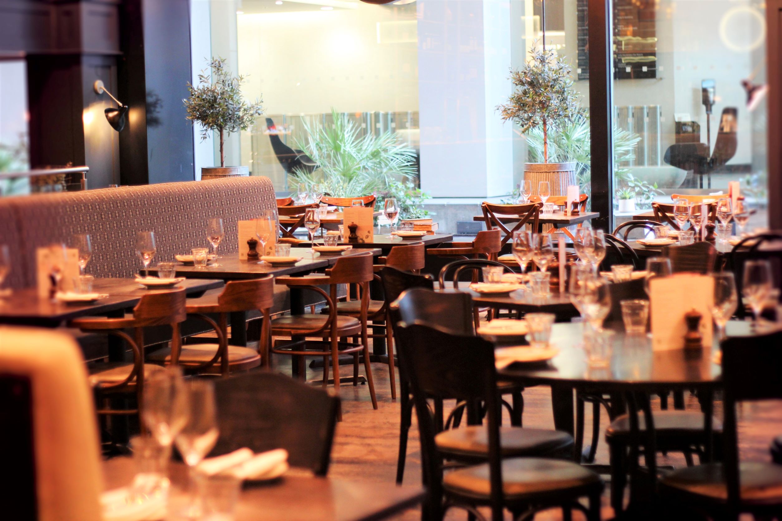 Stylish restaurant venue for corporate events with warm lighting and modern decor.