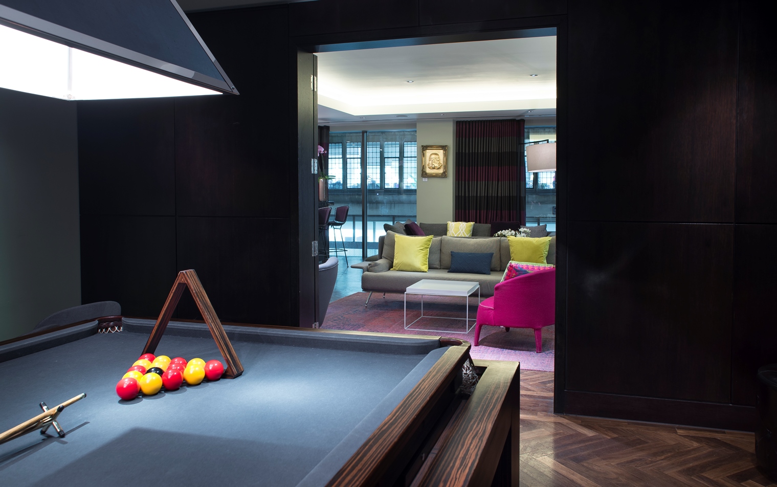 Stylish game room with pool table at South Place Hotel for networking events.