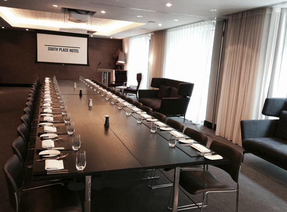 Meeting room at South Place Hotel with long table, ideal for corporate events and workshops.