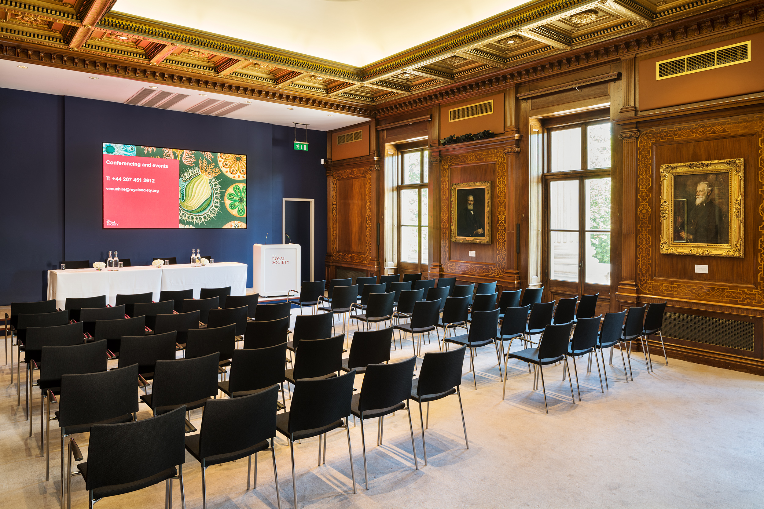 Kohn Centre meeting room with black chairs, ideal for corporate events and conferences.