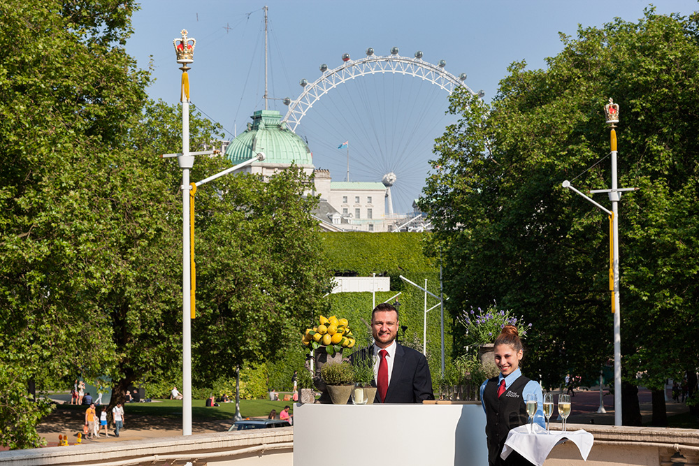 Outdoor event at The Royal Society with London Eye backdrop and elegant service staff.